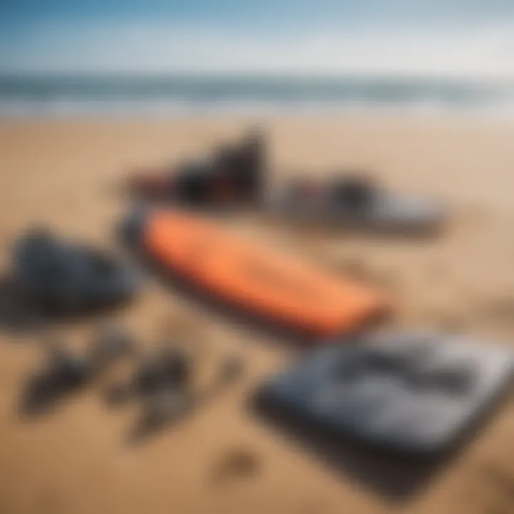 A close-up of essential kite surfing gear laid out on the sand