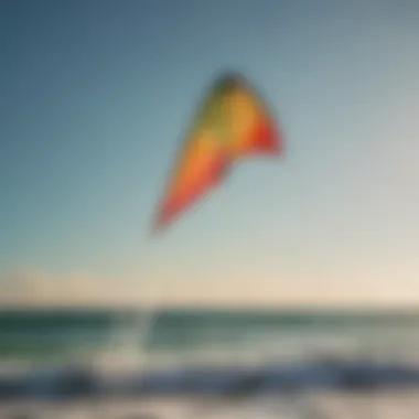 A vibrant kite soaring high above the ocean waves