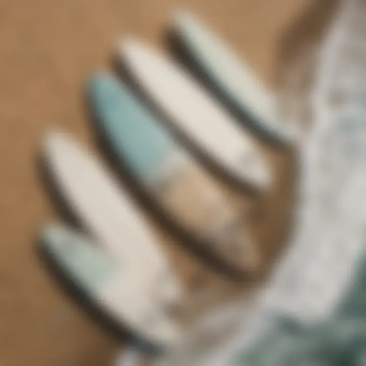 An aerial view of surfboards lined up on the shore as surfers prepare to hit the waves.