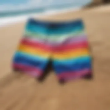 Colorful boardshorts displayed on a sandy beach