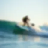 Inflatable Stand-Up Paddleboard Surfing Inflatable stand-up paddleboard on a wave