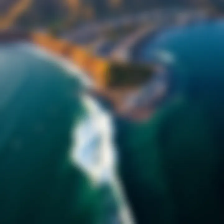 Aerial view of Lahaina's coastline with surfers riding waves