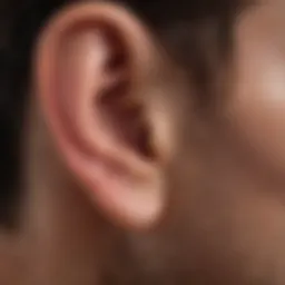 Person demonstrating ear drainage technique