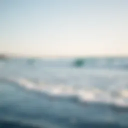 A serene coastline with gentle waves lapping at the shore