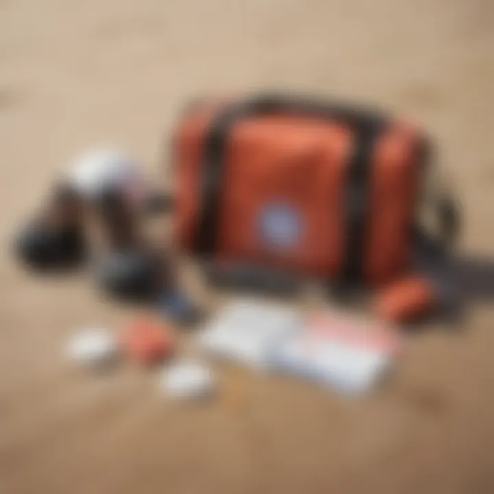 An array of safety accessories including a first aid kit, leash, and helmet arranged on a sandy surface.