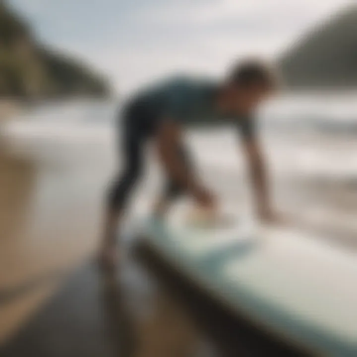 A surfer performing maintenance on their board, utilizing various tools for upkeep.