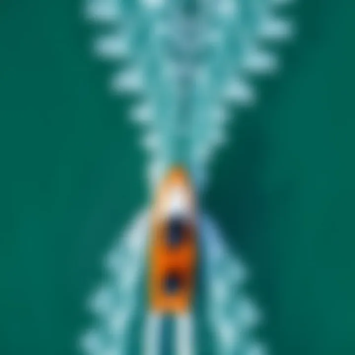 Aerial view of a high-performance axis foil cutting through crystal-clear waters