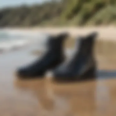 Billabong wetsuit booties on a sandy beach