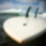 Sleek Design of a High Performance Fish Surfboard Close-up view of a high performance fish surfboard showcasing its sleek design and fin setup