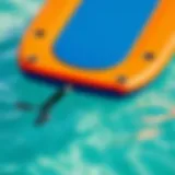 A vibrant inflatable boogie board in clear blue water