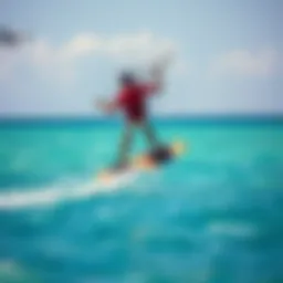 Kiteboarder soaring through the clear blue waters of Bonaire