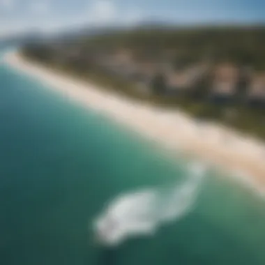 An aerial view of a popular kiteboarding destination, showcasing the stunning coastline and water conditions