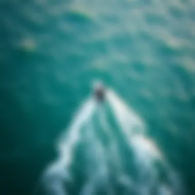 An aerial view of a kiteboarder navigating through ocean conditions