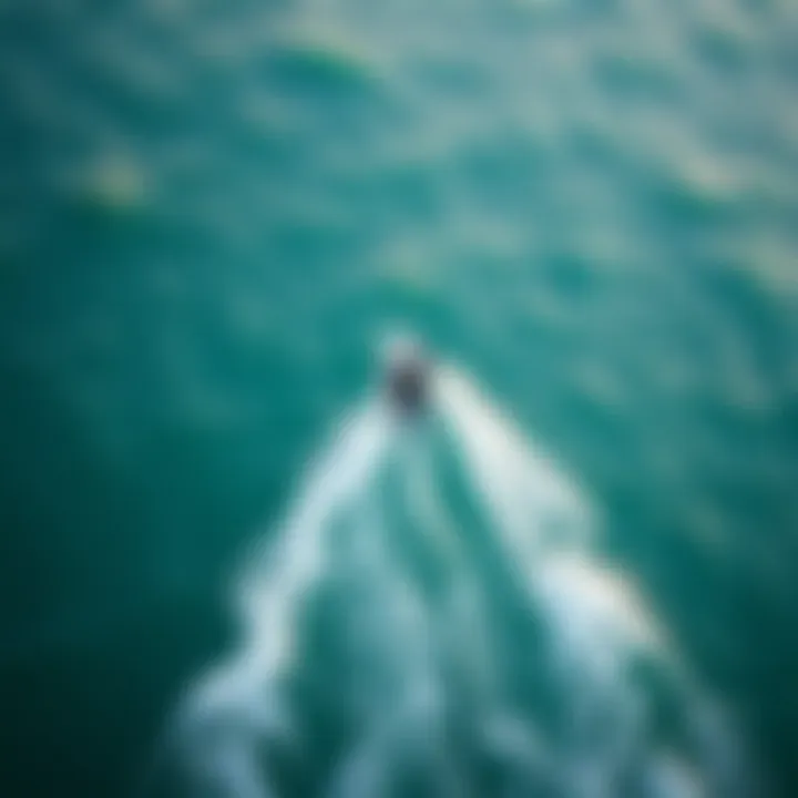 An aerial view of a kiteboarder navigating through ocean conditions