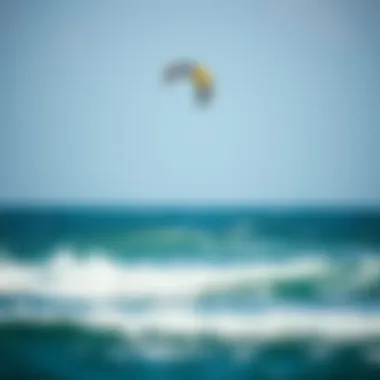 A kite soaring above the ocean waves during a kiteboarding session