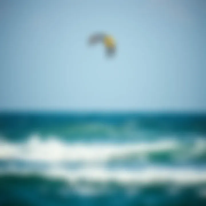 A kite soaring above the ocean waves during a kiteboarding session