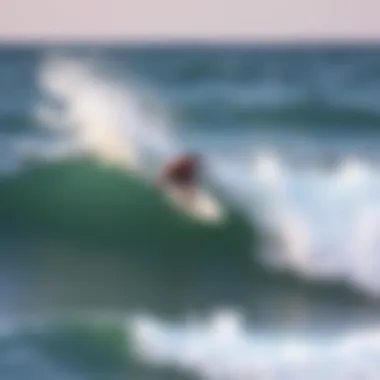 Surfer at Playa Zicatela Surfer riding a wave at Playa Zicatela