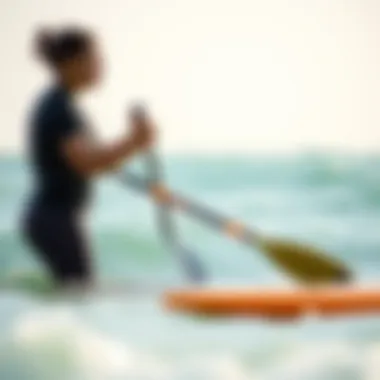 Paddling Technique Instruction Instructor demonstrating paddling technique in the ocean