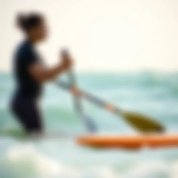 Paddling Technique Instruction Instructor demonstrating paddling technique in the ocean