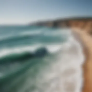 Scenic view of Algarve coastline with surfers