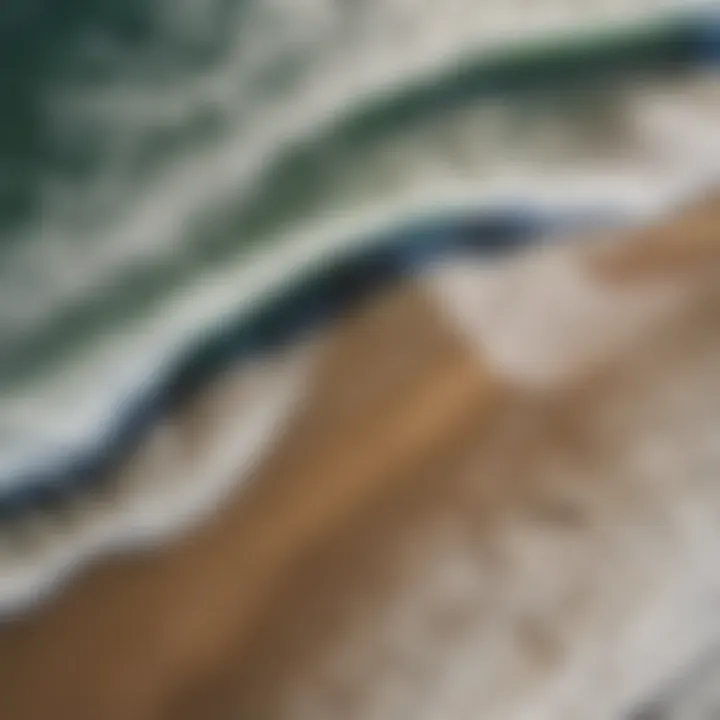 Aerial view of the coastline illustrating wave patterns and surfline dynamics.