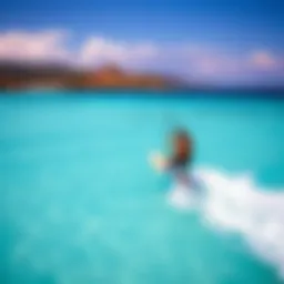 A breathtaking view of a kite surfer gliding over turquoise waters