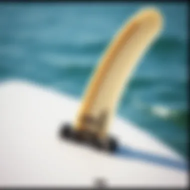Close-up of a quad fin mounted on a surfboard highlighting its construction