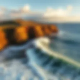 Aerial view of a surfer catching a wave at Ho'okipa Beach