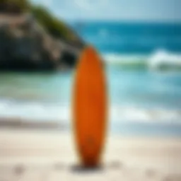 A vibrant surfboard lined up against the sandy beach