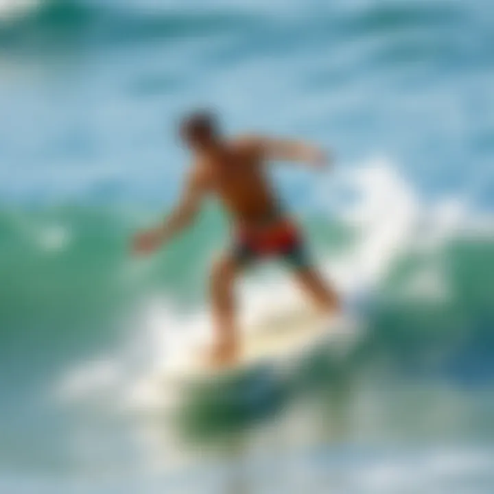 An action shot of a surfer catching a wave wearing vibrant swim trunks