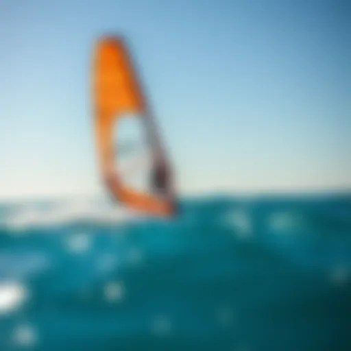 Windsurfer in Action A windsurfer catching the wind on a vibrant blue ocean