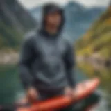 The Trail Harbor Hoody showcased against a scenic watersport backdrop