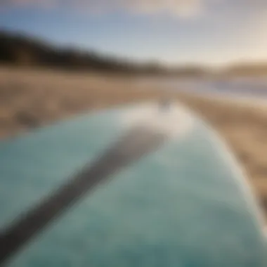 A close-up of a surfboard showing its unique design and wear, illustrating its character.