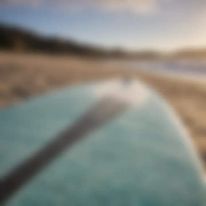 A close-up of a surfboard showing its unique design and wear, illustrating its character.