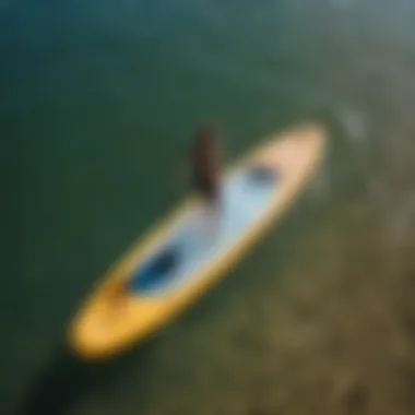 A paddler effortlessly maneuvering a folding paddle board