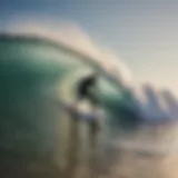 A surfer catching a wave at Galveston Beach