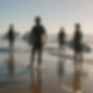 A group of surfers discussing techniques on the beach