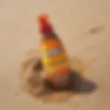 A bottle of Sun Bum Beach Spray on a sandy beach