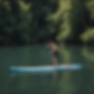 User testing inflatable paddleboards on calm waters demonstrating their stability.