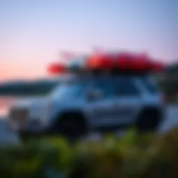 A sleek vehicle with a roof rack loaded with kayaks ready for adventure
