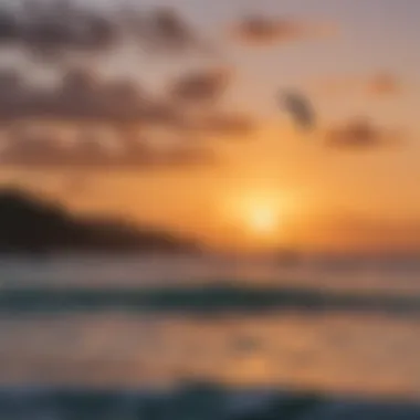 A vibrant sunset view over the water with surfers silhouetted