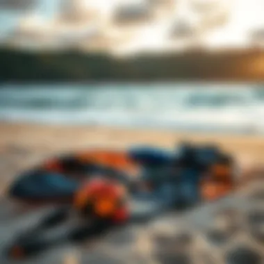 An array of kitesurfing gear laid out on the beach, showcasing essential equipment for enthusiasts.