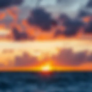 A picturesque sunset over the ocean, where kitesurfers navigate the water in perfect harmony with nature.