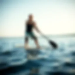 Paddle boarder demonstrating knee pads on a serene lake