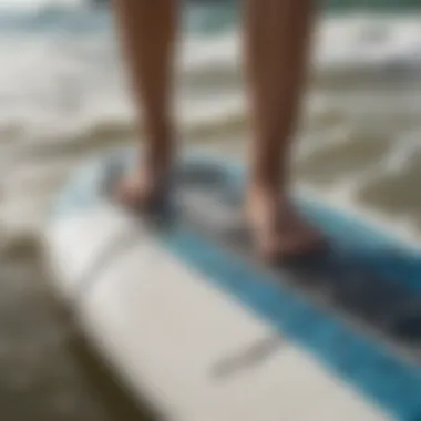 A close-up of wakesurfing gear showcasing the board and rope.