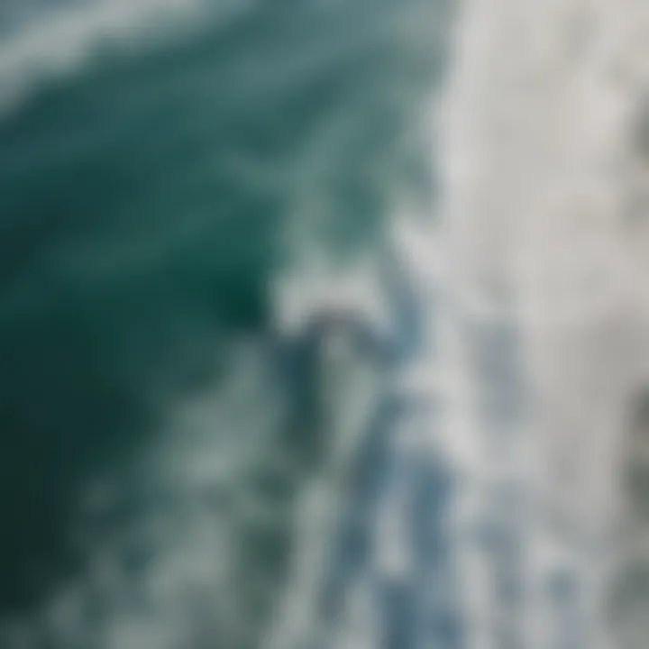 An aerial view of a boat creating perfect waves for surfing