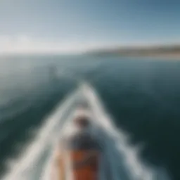 A surfer gliding gracefully behind a motorboat on calm waters