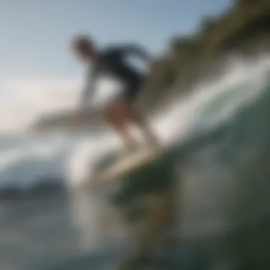 Beginner surfer riding a gentle wave on a soft-top surfboard