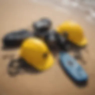 Safety gear for water sports laid out on a sandy shore