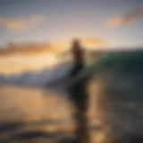 A stunning shot of a surfer catching a wave at sunset on the Big Island.